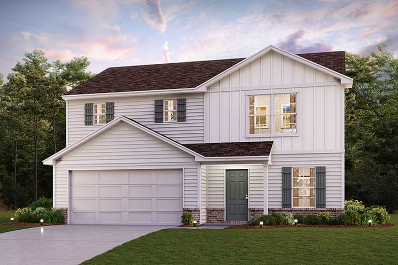 A white house with a garage.