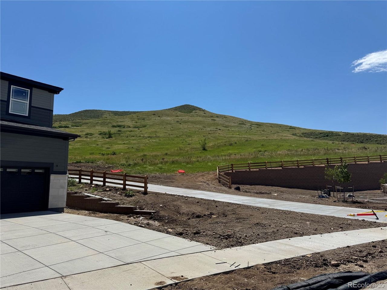Front exterior of a new home in The Manors Collection at Golden Overlook, Golden, CO, highlighting curb appeal (Image 2).
