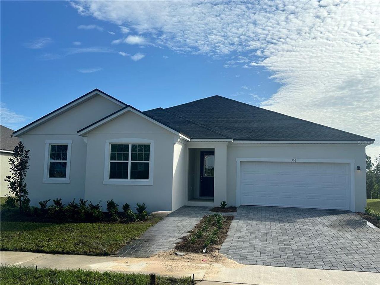 Front exterior of a new home in Rainwood, Clermont, FL, highlighting curb appeal (Image 2). Front exterior of a new home in Rainwood, Clermont, FL, highlighting curb appeal (Image 2).
