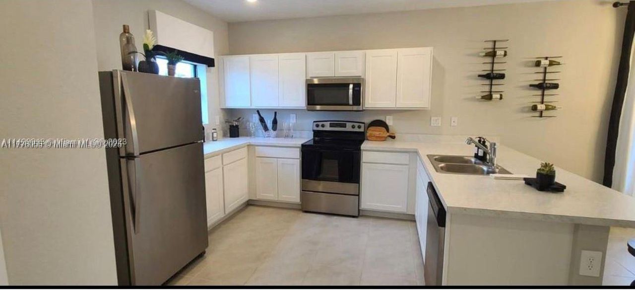 Furnished interior view inside a new home in , Florida City (Image 2).
