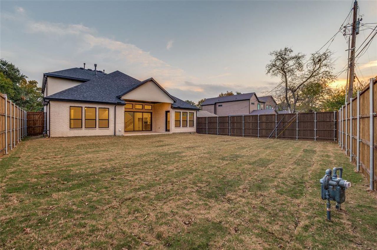 Back of house featuring a patio and a large, fenced backyard Back of house featuring a patio and a large, fenced backyard