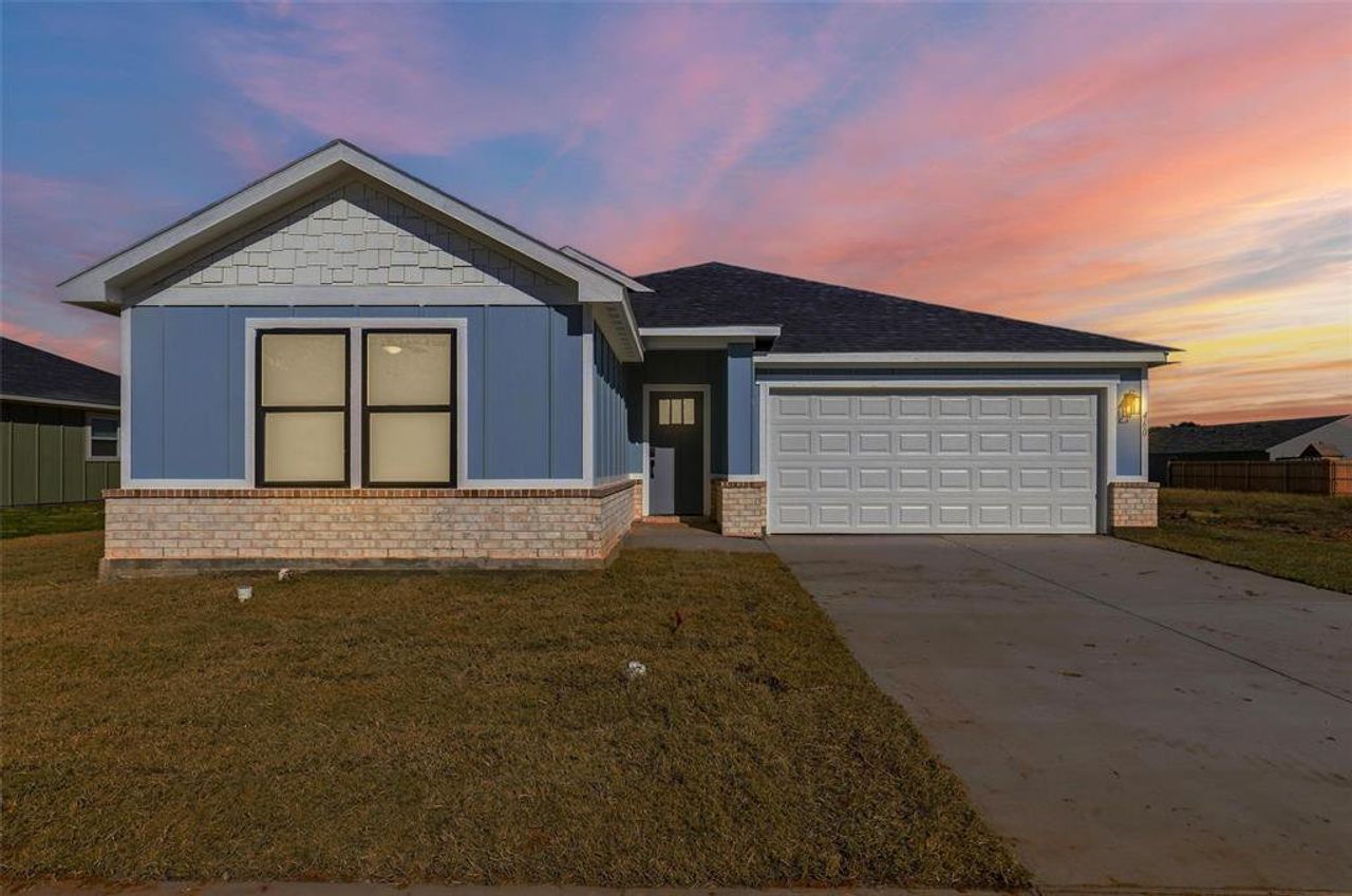 Front exterior of a new home in , Tolar, TX, highlighting curb appeal (Image 2). Front exterior of a new home in , Tolar, TX, highlighting curb appeal (Image 2).