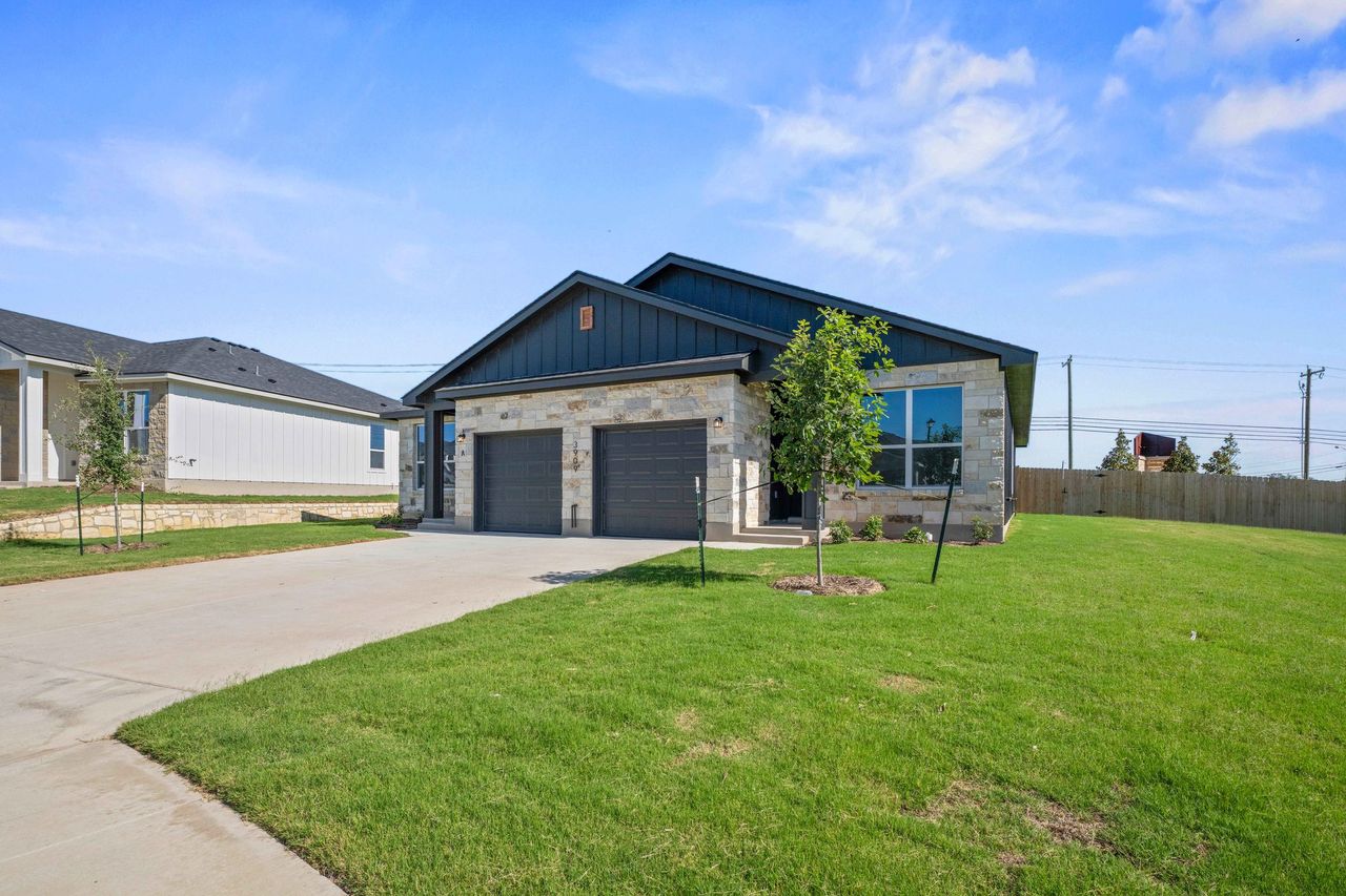 Front exterior of a new home in The Preserve at Thousand Oaks Duplexes, Killeen, TX, highlighting curb appeal (Image 2). Front exterior of a new home in The Preserve at Thousand Oaks Duplexes, Killeen, TX, highlighting curb appeal (Image 2).