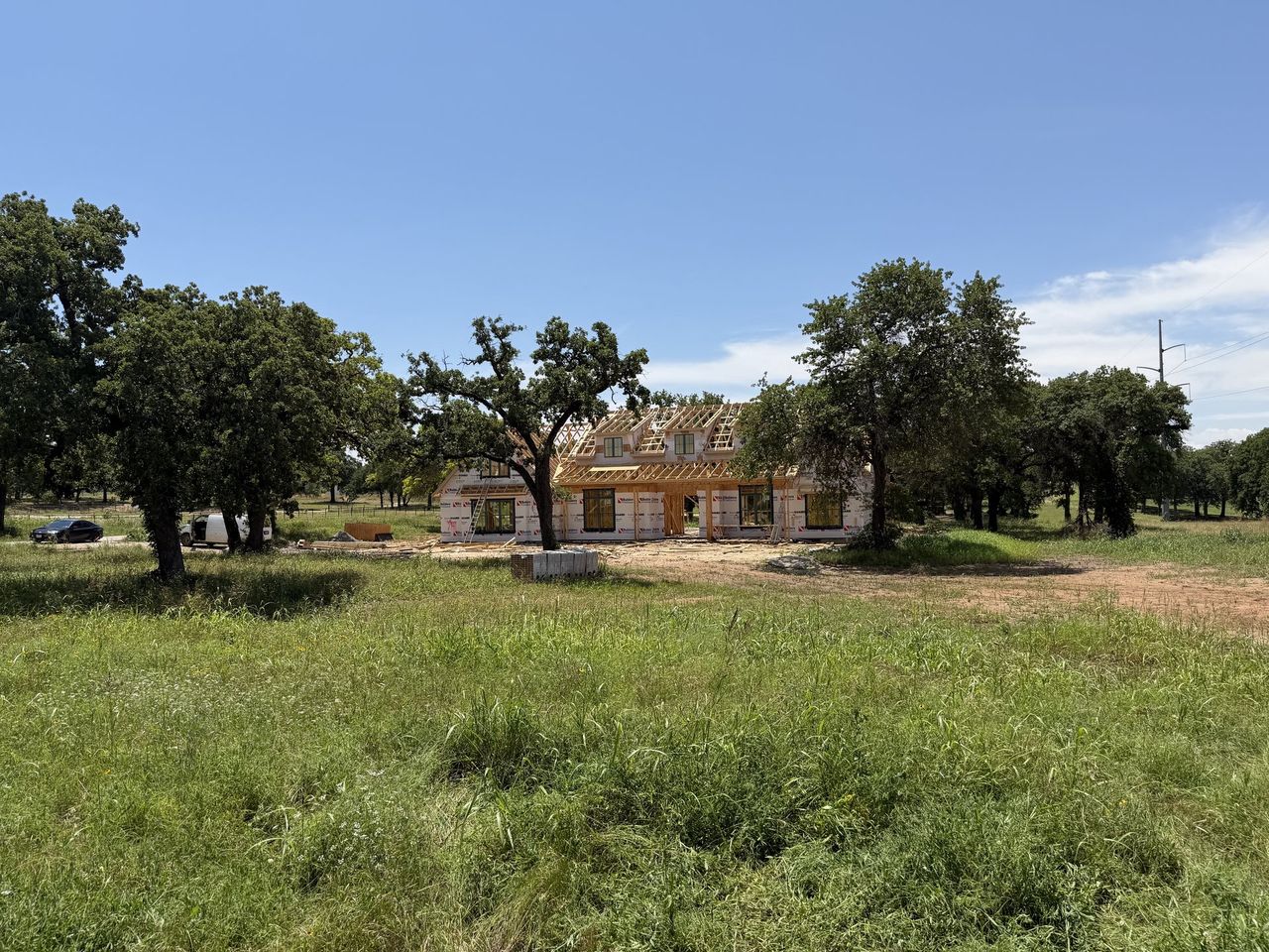 Front exterior of a new home in Santana Ridge - Brock ISD, Weatherford, TX, highlighting curb appeal (Image 2).