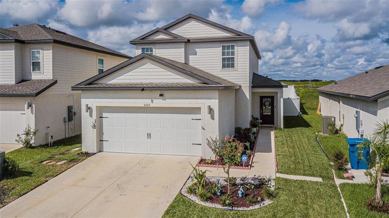 Front exterior of a new home in Trilby Crossing, Brooksville, FL, highlighting curb appeal (Image 2).