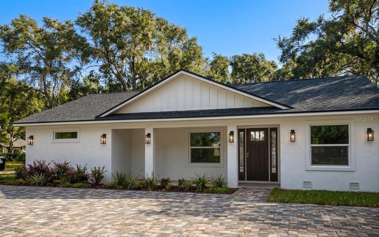 Front exterior of a new home in , Orange City, FL, highlighting curb appeal (Image 2).
