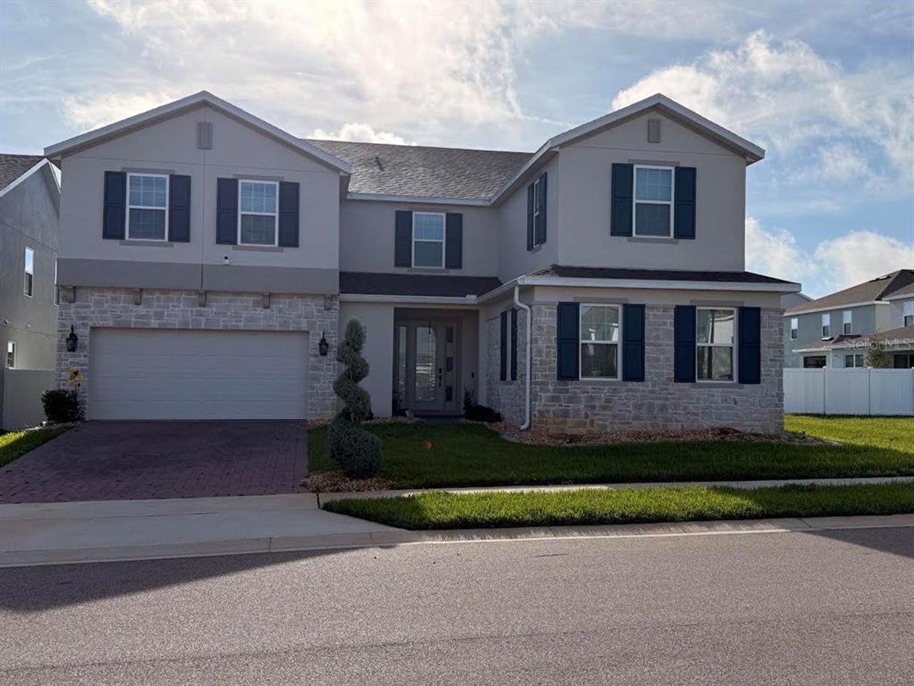 Front exterior of a new home in , Groveland, FL, highlighting curb appeal (Image 2).