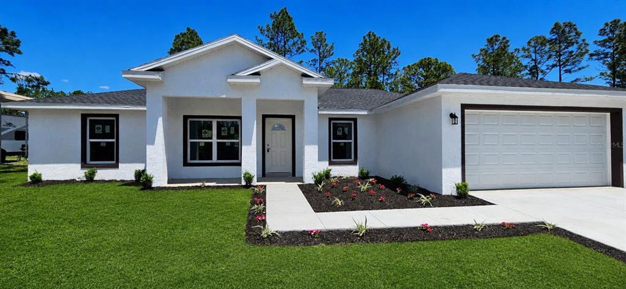 Front exterior of a new home in , Citrus Springs, FL, highlighting curb appeal (Image 2). Front exterior of a new home in , Citrus Springs, FL, highlighting curb appeal (Image 2).