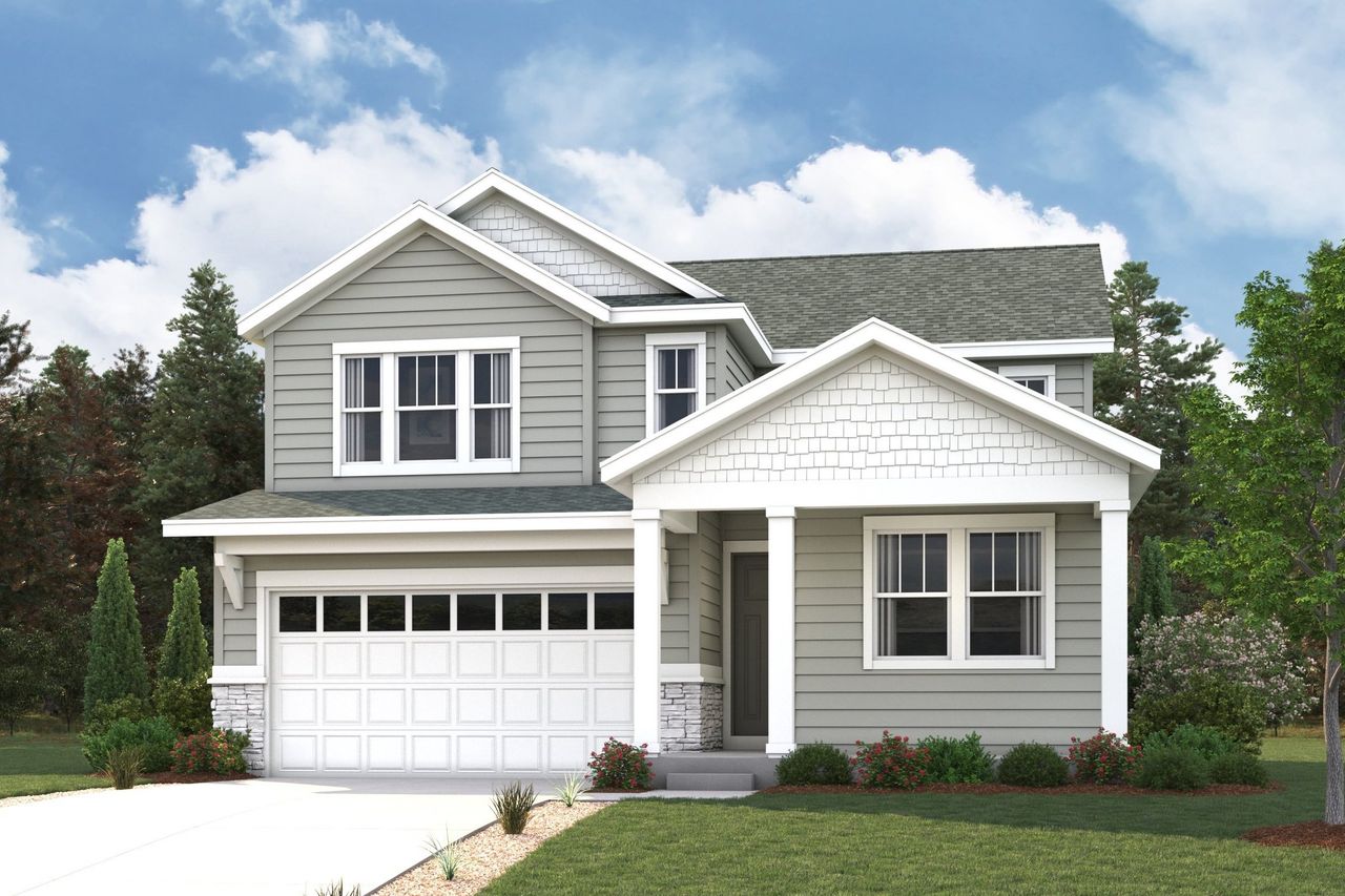 A white house with a green lawn.