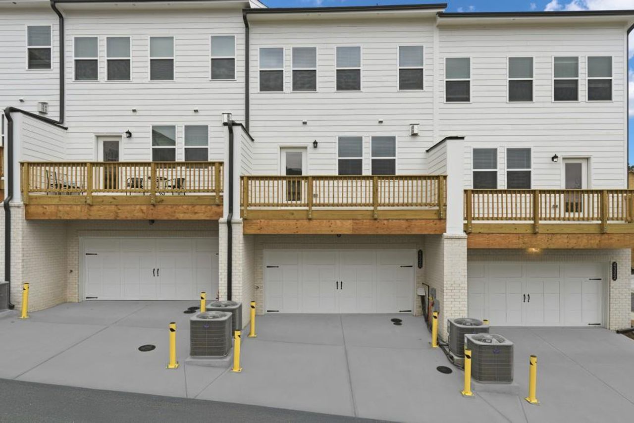 Exterior details and patio area of a home in Towns at Creekside, Doraville (Image 2). Exterior details and patio area of a home in Towns at Creekside, Doraville (Image 2).