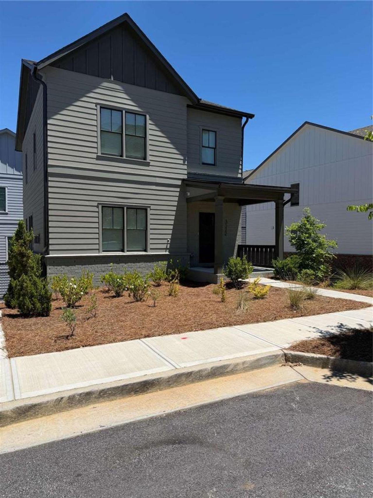 Front exterior of a new home in Stillwood, Hapeville, GA, highlighting curb appeal (Image 2).