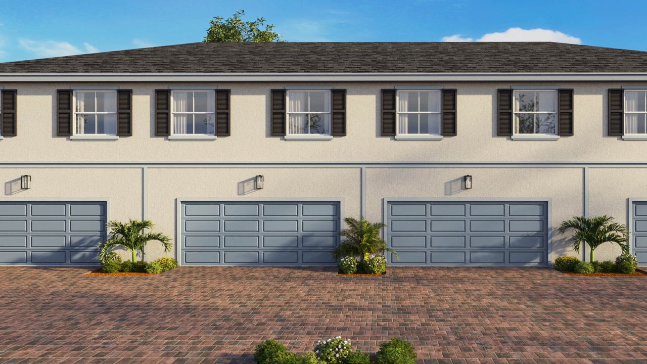 Front exterior of a new home in Sailfish Cay, Stuart, FL, highlighting curb appeal (Image 2).