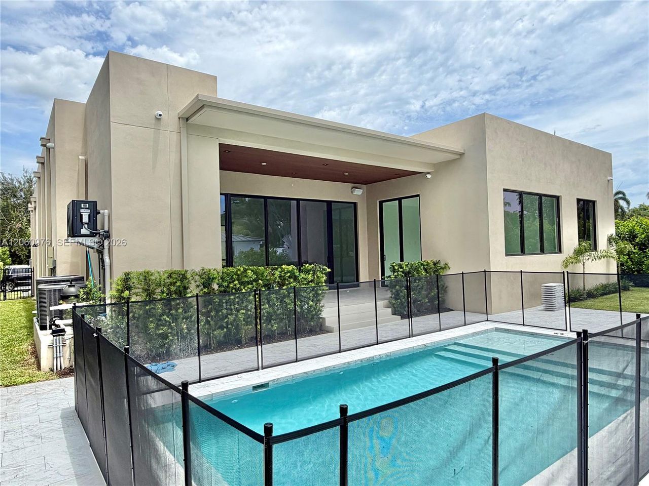 Exterior details and patio area of a home in , North Miami (Image 2).