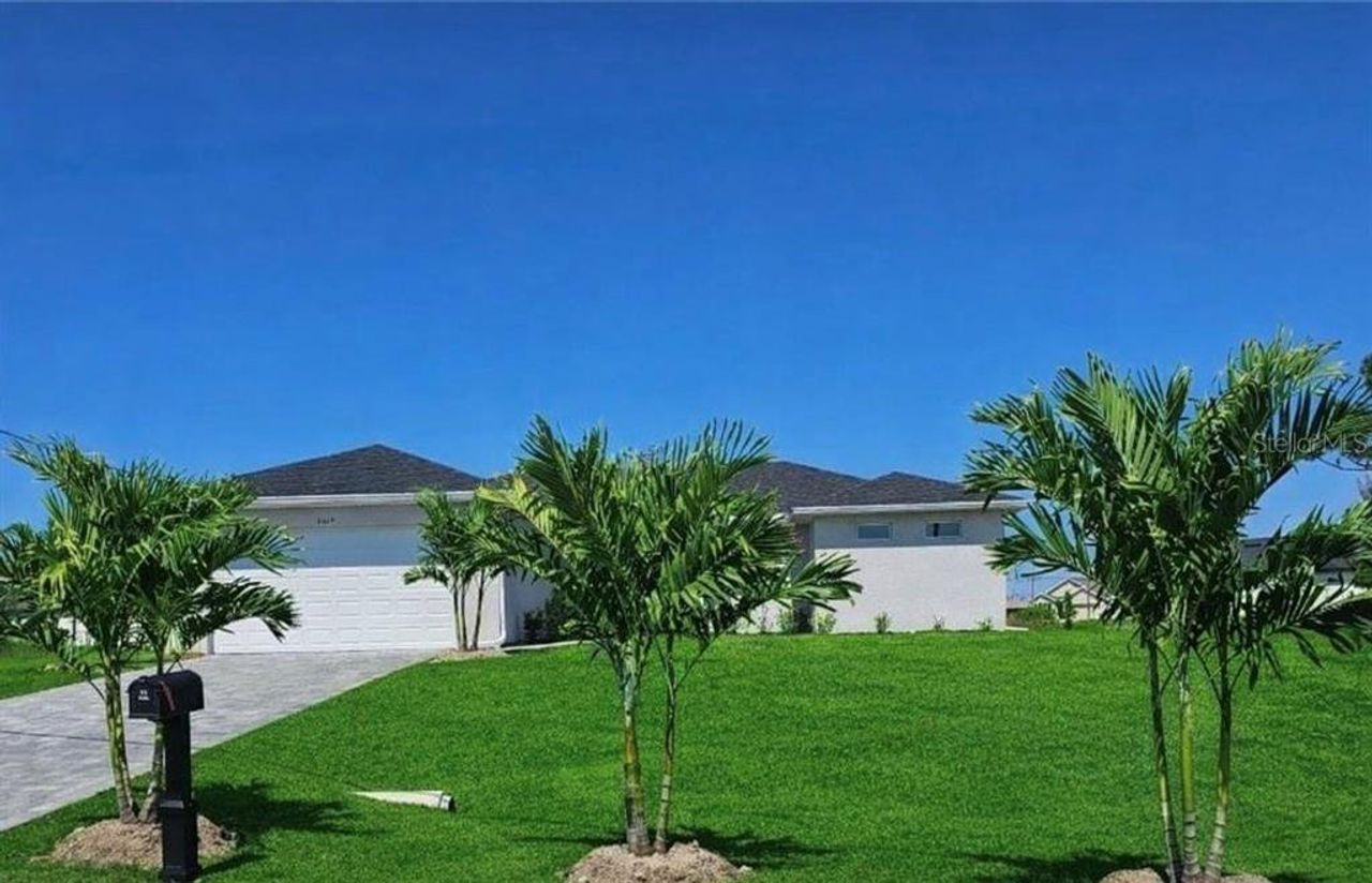 Front exterior of a new home in , Cape Coral, FL, highlighting curb appeal (Image 2).