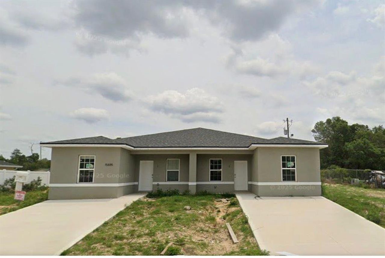 Front exterior of a new home in , Ocala, FL, highlighting curb appeal (Image 2).