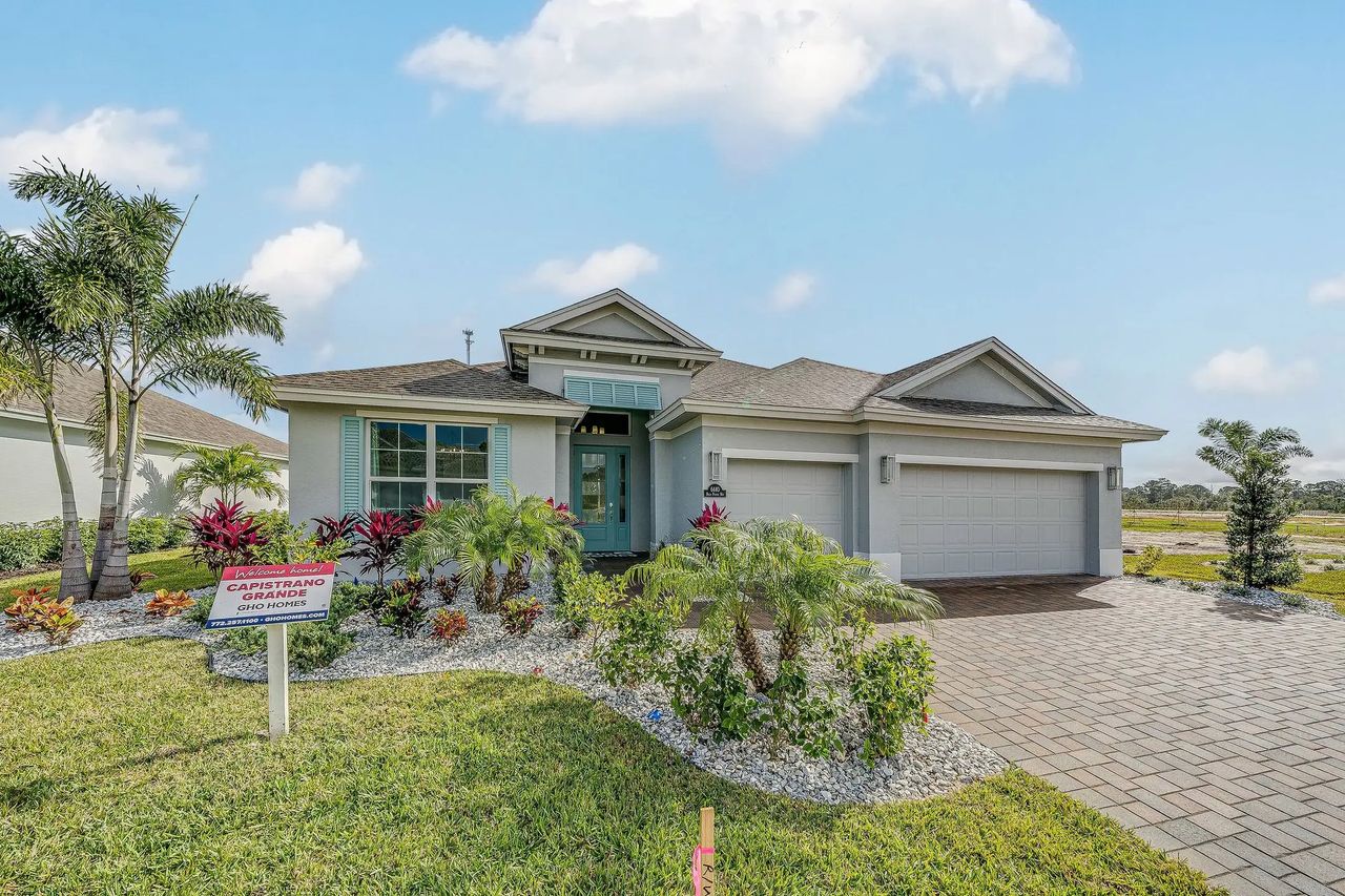 Front exterior of a new home in High Pointe, Winter Beach, FL, highlighting curb appeal (Image 2).