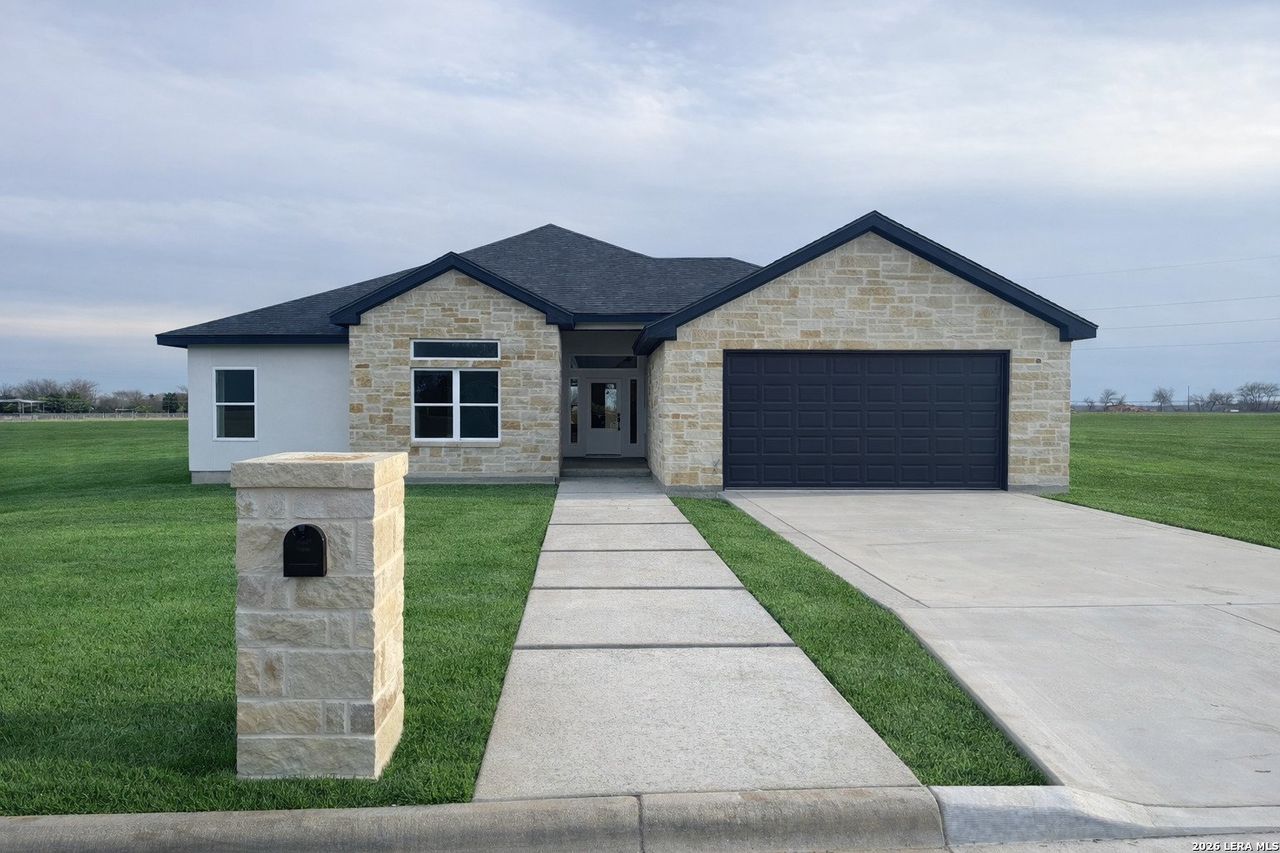 Front exterior of a new home in , Hondo, TX, highlighting curb appeal (Image 2).