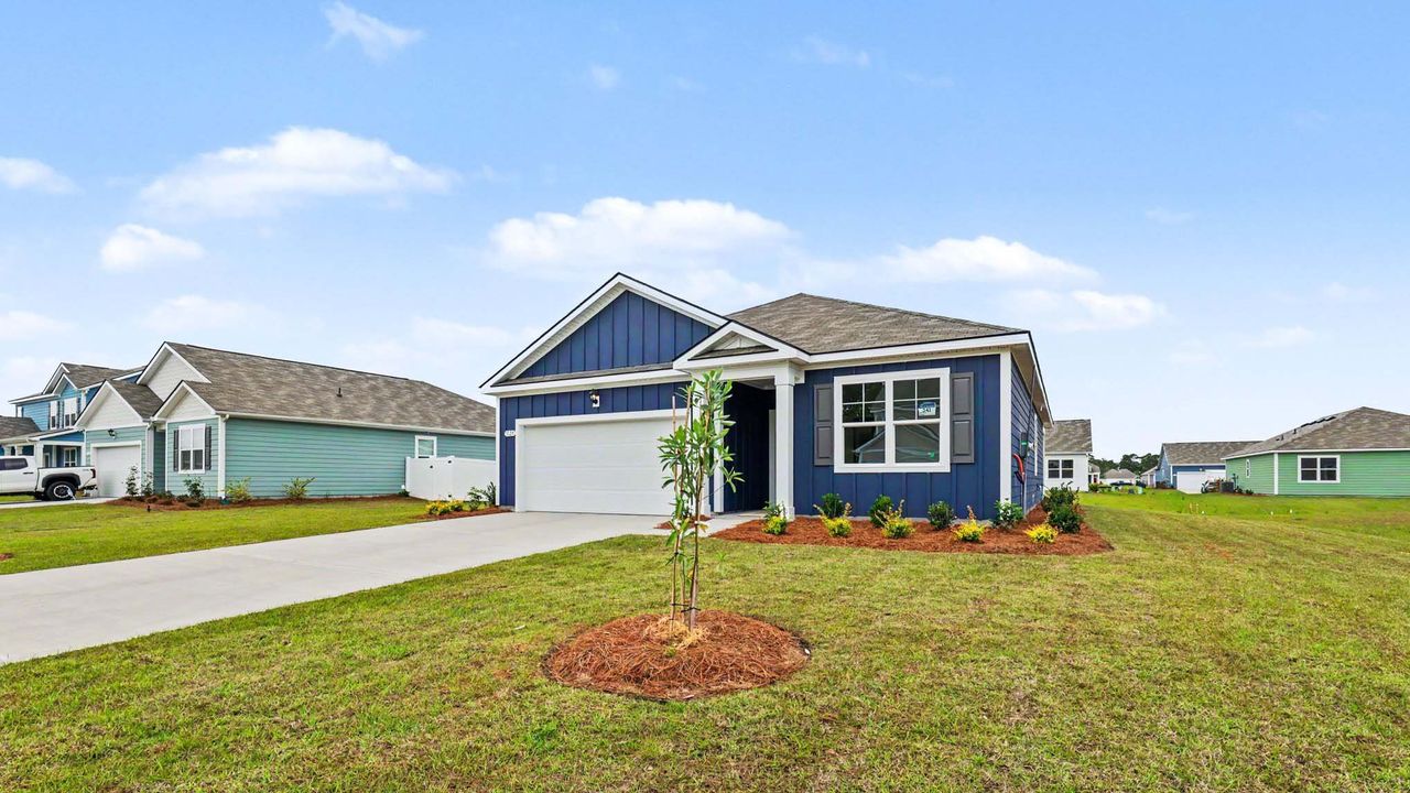 Front exterior of a new home in Auberon Woods, Conway, SC, highlighting curb appeal (Image 2). Front exterior of a new home in Auberon Woods, Conway, SC, highlighting curb appeal (Image 2).