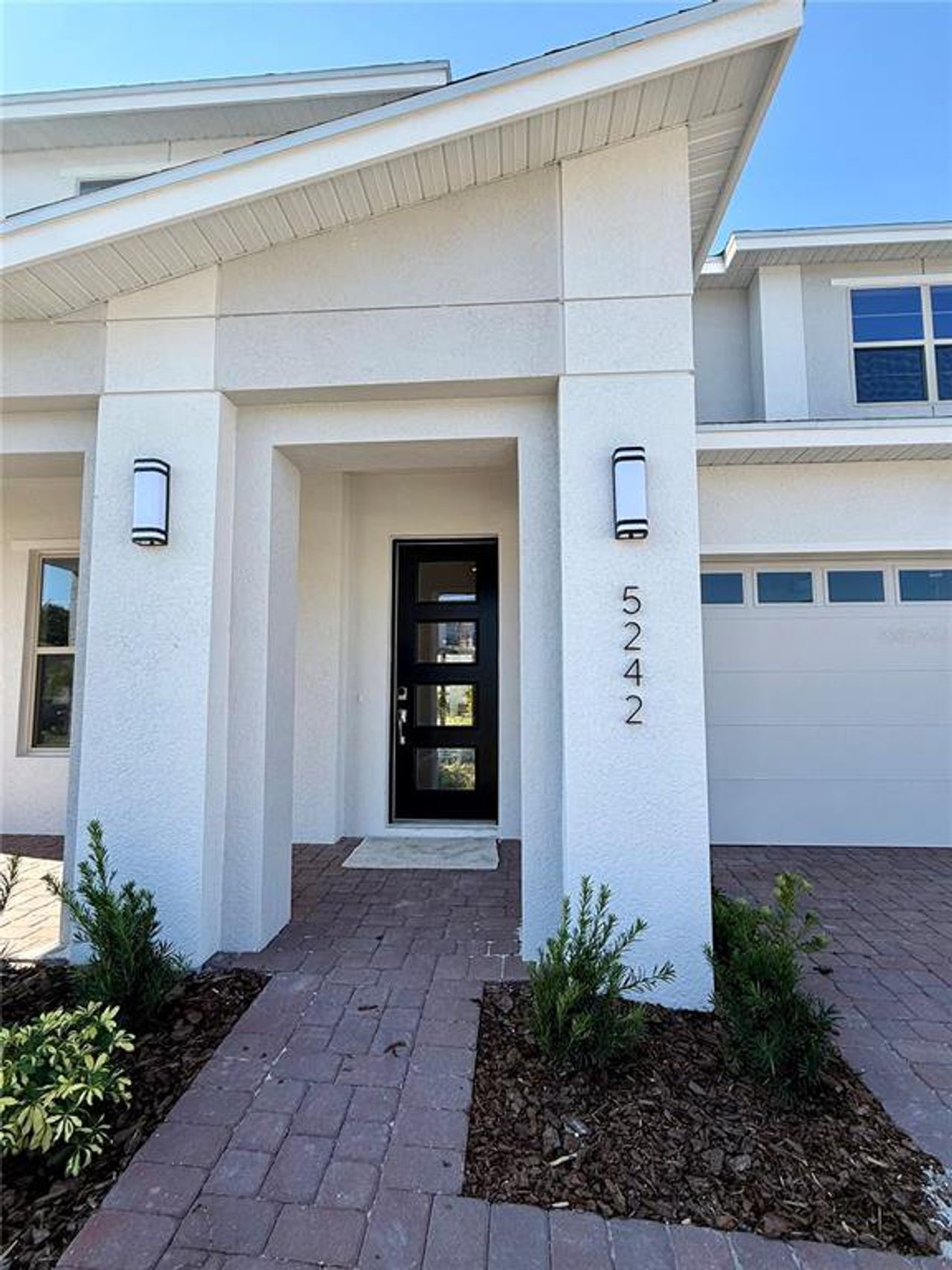 Exterior details and patio area of a home in Reserve at Twin Lakes, St. Cloud (Image 2).