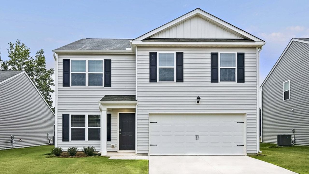 Front exterior of a new home in Wilson's Ridge, Wilson's Mills, NC, highlighting curb appeal (Image 2).
