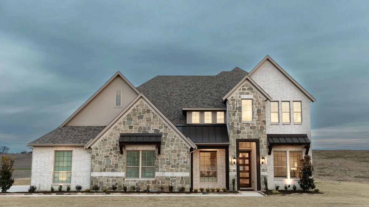 Front exterior of a home in the Sister Grove II community, located in Van Alstyne, TX (Image 2).