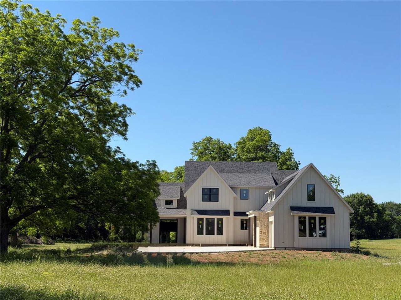 Front exterior of a new home in , Whitesboro, TX, highlighting curb appeal (Image 2). Front exterior of a new home in , Whitesboro, TX, highlighting curb appeal (Image 2).