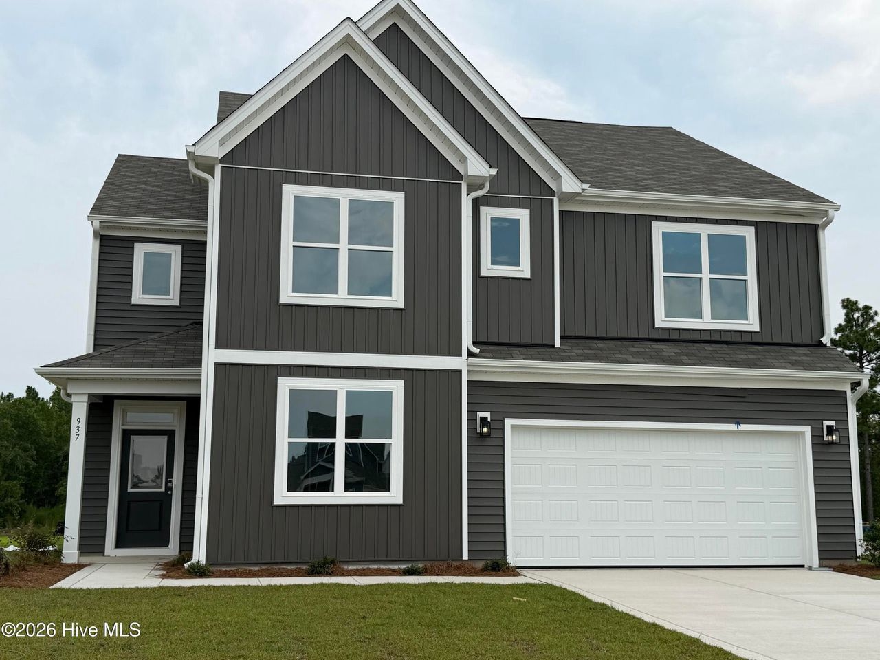 Front exterior of a new home in Sandy Springs, Aberdeen, NC, highlighting curb appeal (Image 2). Front exterior of a new home in Sandy Springs, Aberdeen, NC, highlighting curb appeal (Image 2).