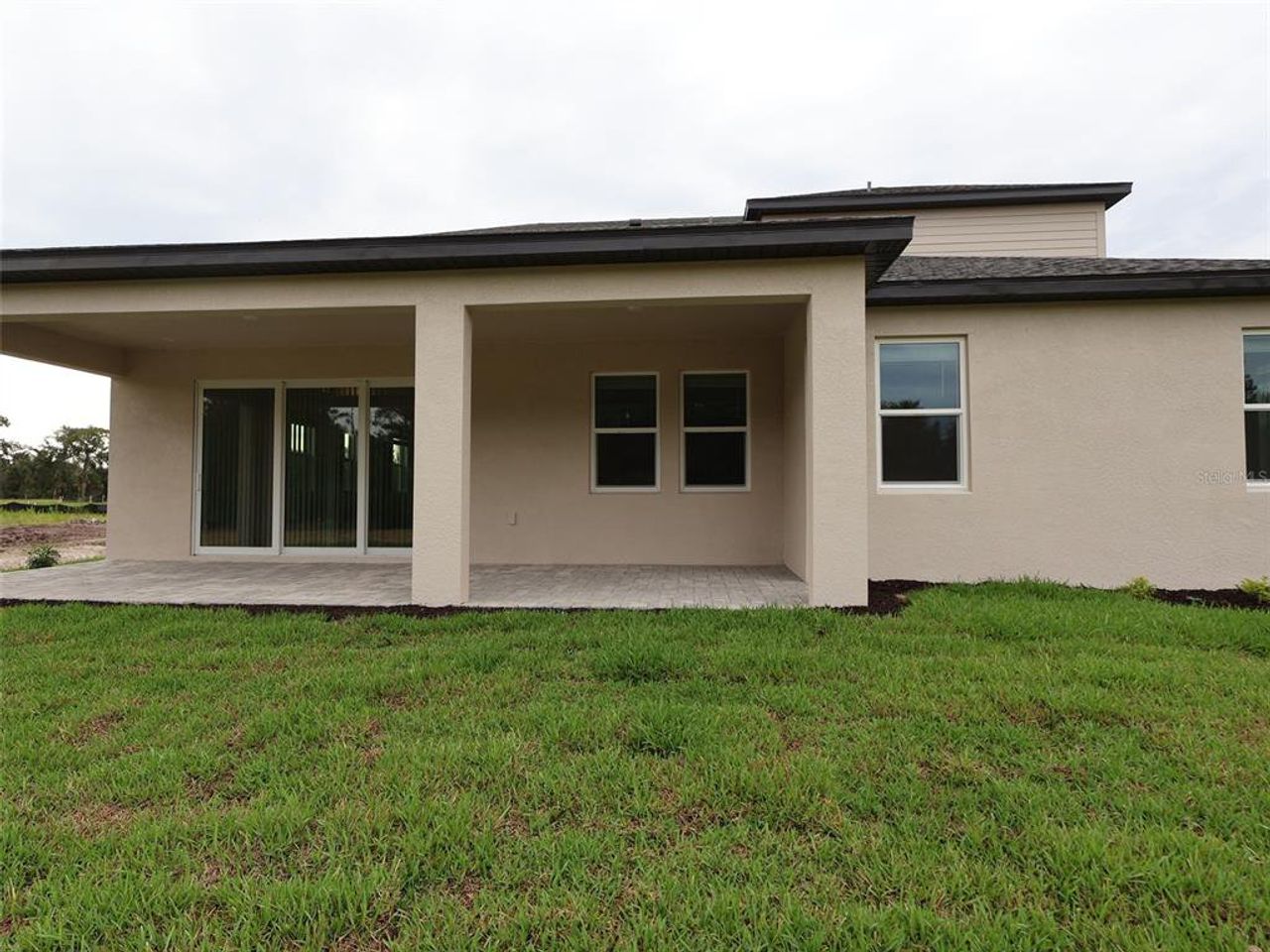 Exterior details and patio area of a home in Creeks Edge at Twin Rivers, Parrish (Image 2). Exterior details and patio area of a home in Creeks Edge at Twin Rivers, Parrish (Image 2).