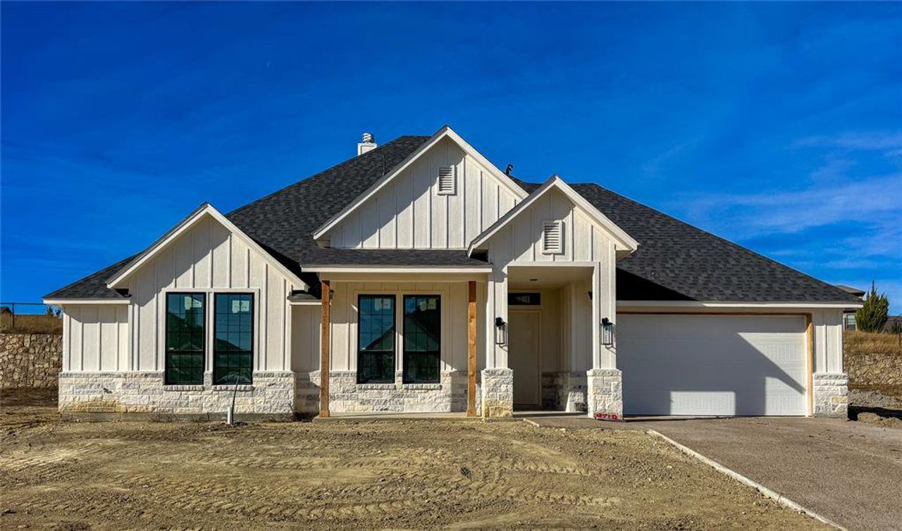 Front exterior of a new home in Whitestone Crest, Benbrook, TX, highlighting curb appeal (Image 2).