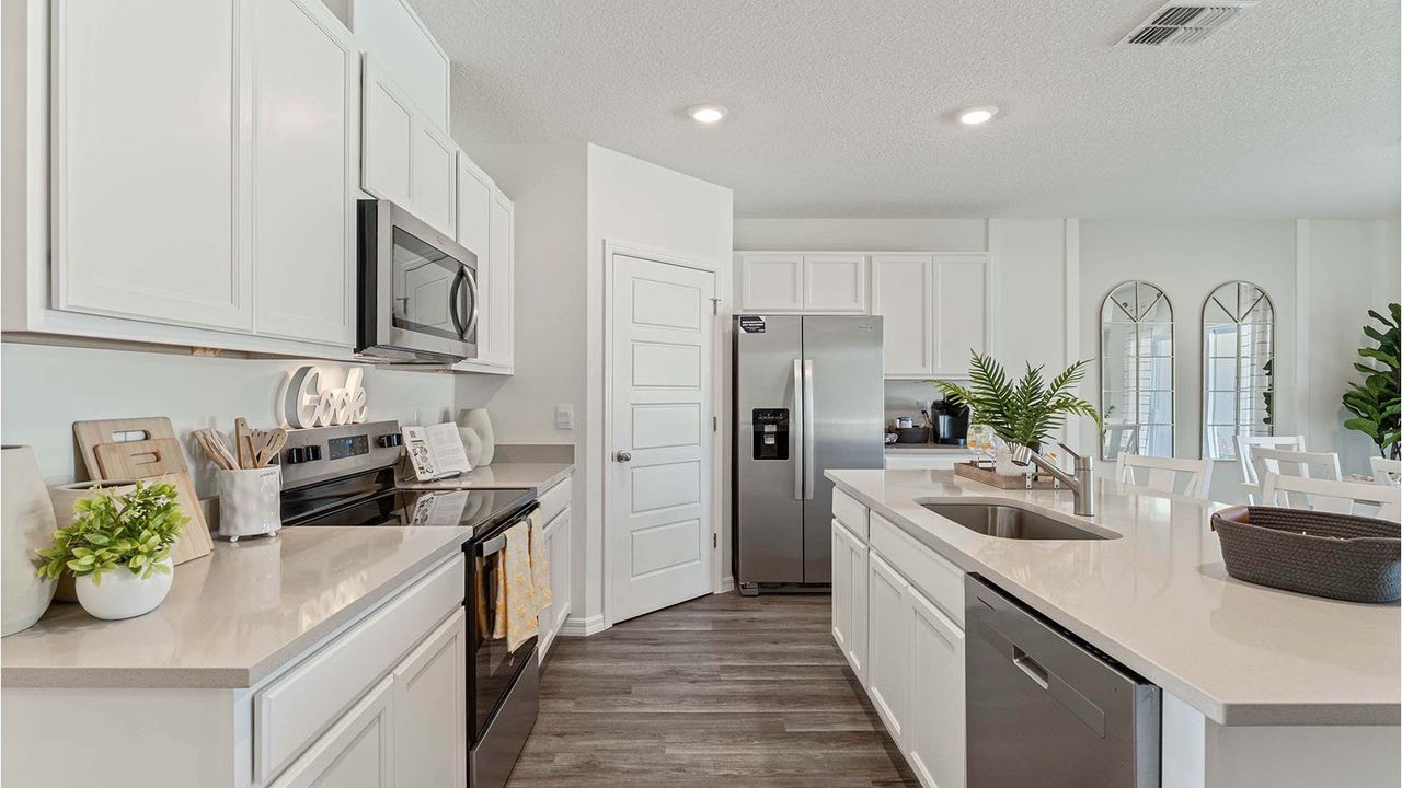 Representative furnished interior of a home built from the Cali by D.R. Horton in Magnolia Pointe, Umatilla (Image 2).