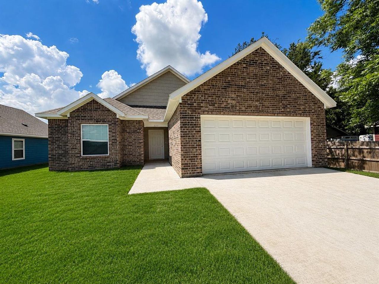 Front exterior of a new home in , Cleburne, TX, highlighting curb appeal (Image 2).