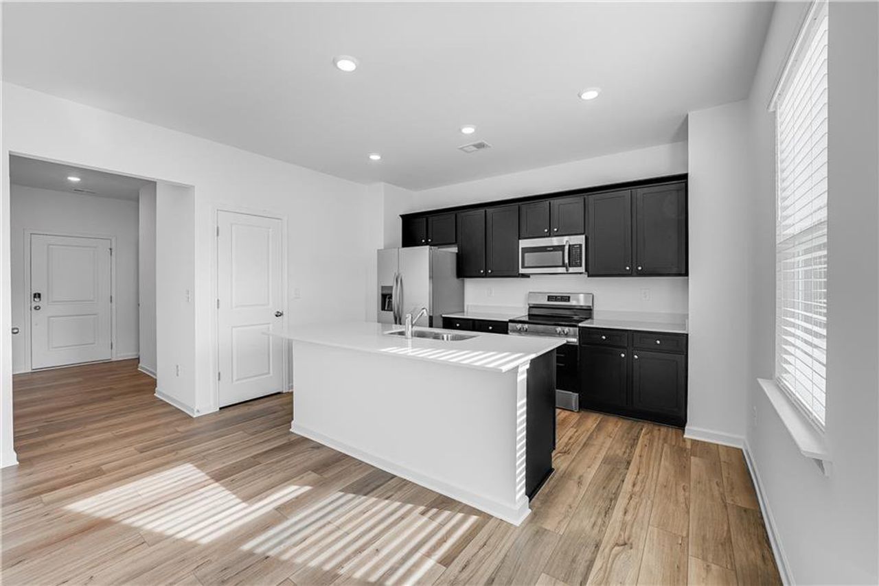 Furnished interior view inside a new home in Crossvine Village, LaGrange (Image 2).