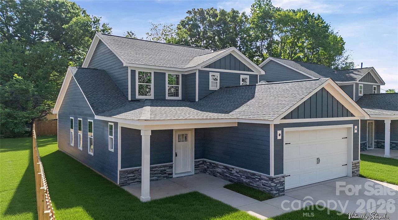 Front exterior of a new home in , Huntersville, NC, highlighting curb appeal (Image 2).