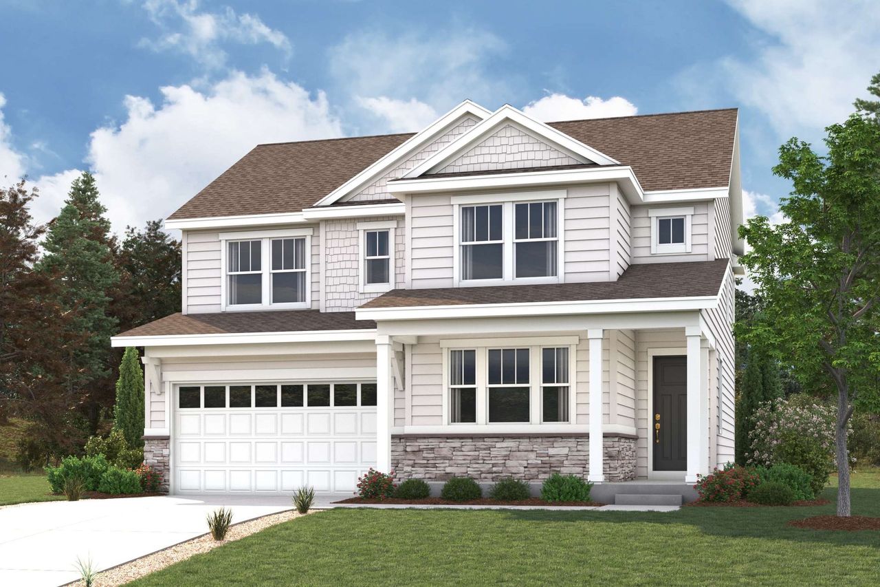 A white house with a green lawn.