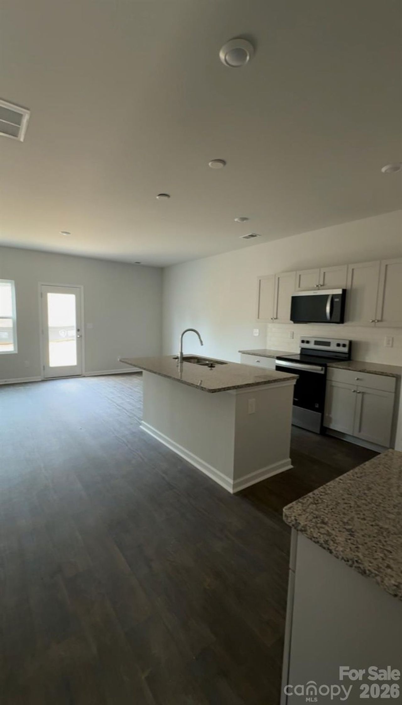 Spacious, unfurnished interior of a new home in Townes at Ribbon Walk, Charlotte (Image 2).