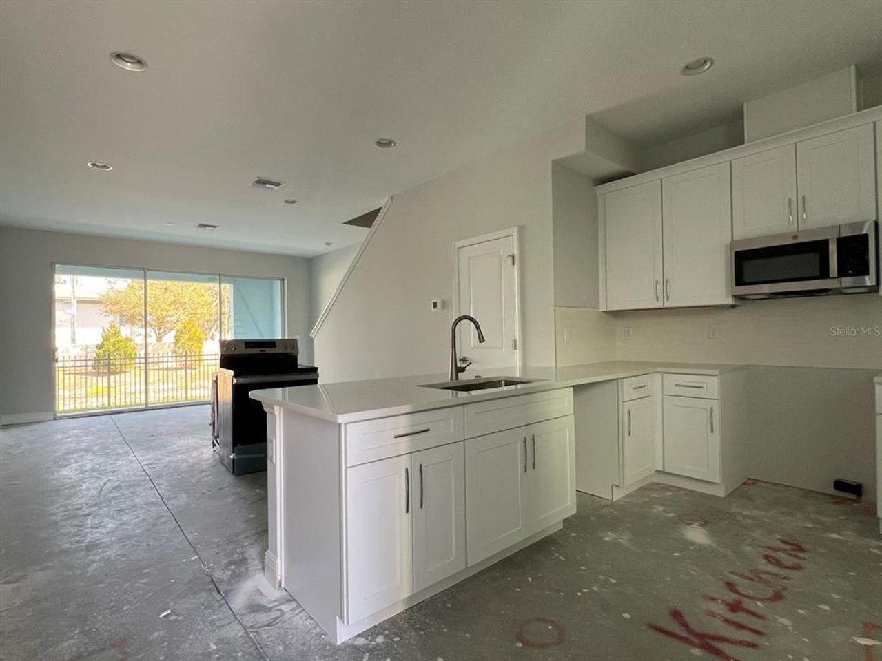 In-progress construction of a new home in The Towns At Long Bayou, Seminole, FL (Image 2).