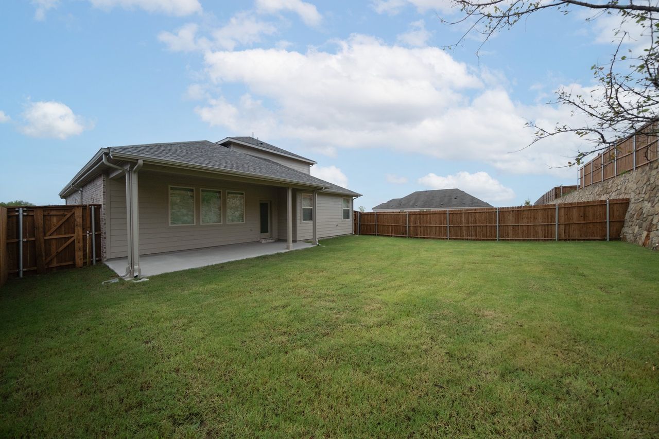 Exterior details and patio area of a home in The Villages of Hurricane Creek, Anna (Image 2).