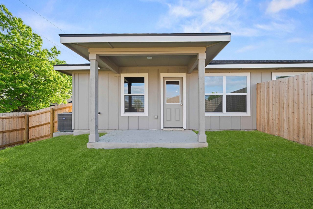 Exterior details and patio area of a home in College Park Townhomes, Troy (Image 2).