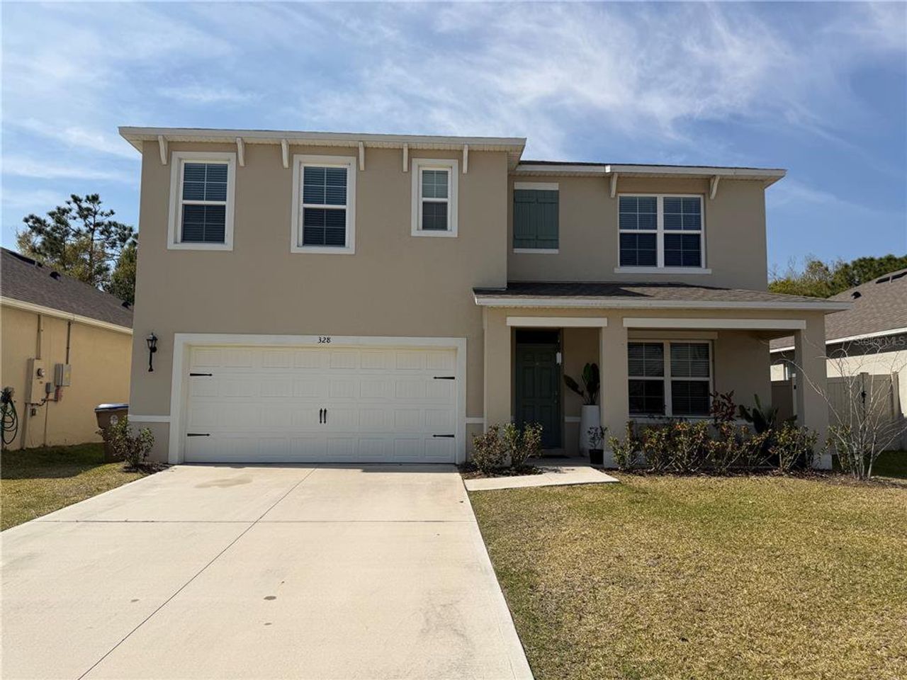 Front exterior of a new home in Preston Cove, St. Cloud, FL, highlighting curb appeal (Image 2).