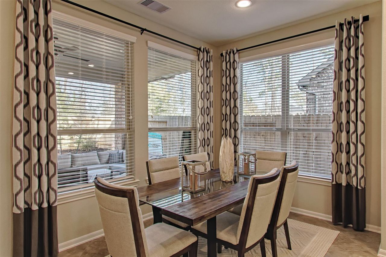 Furnished interior view inside a new home in Sunterra, Katy (Image 2).