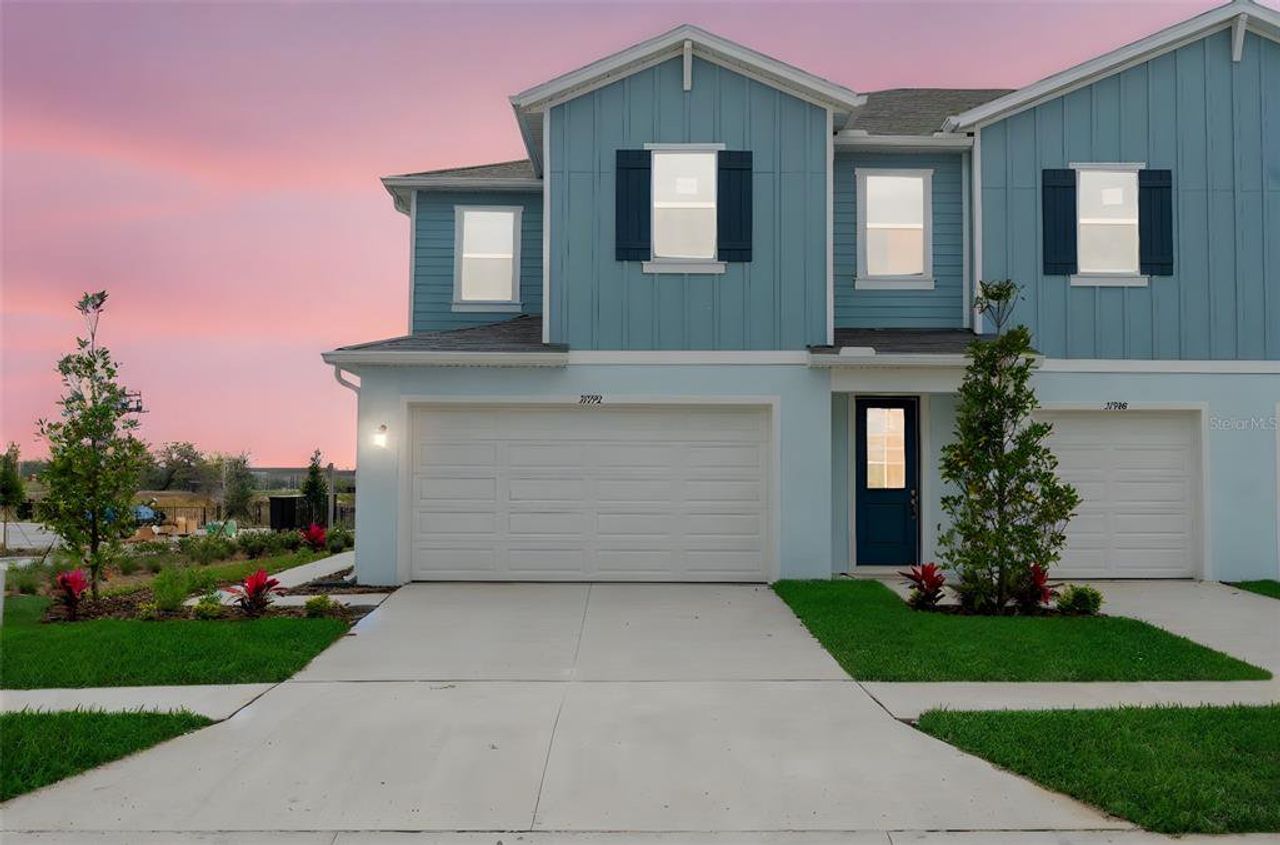 Front exterior of a new home in Shores at Mirada, San Antonio, FL, highlighting curb appeal (Image 2).