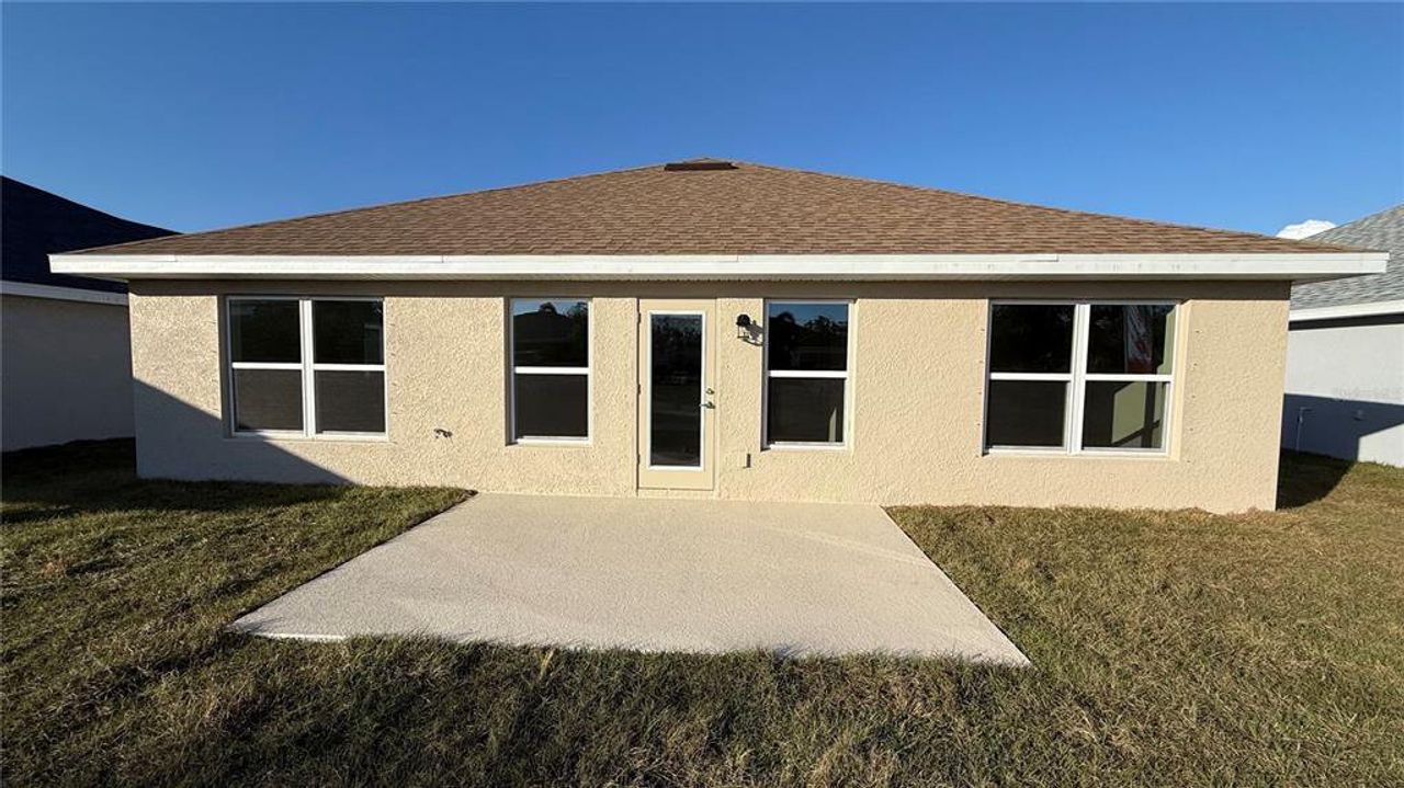Exterior details and patio area of a home in Watercress Cove, North Port (Image 2).