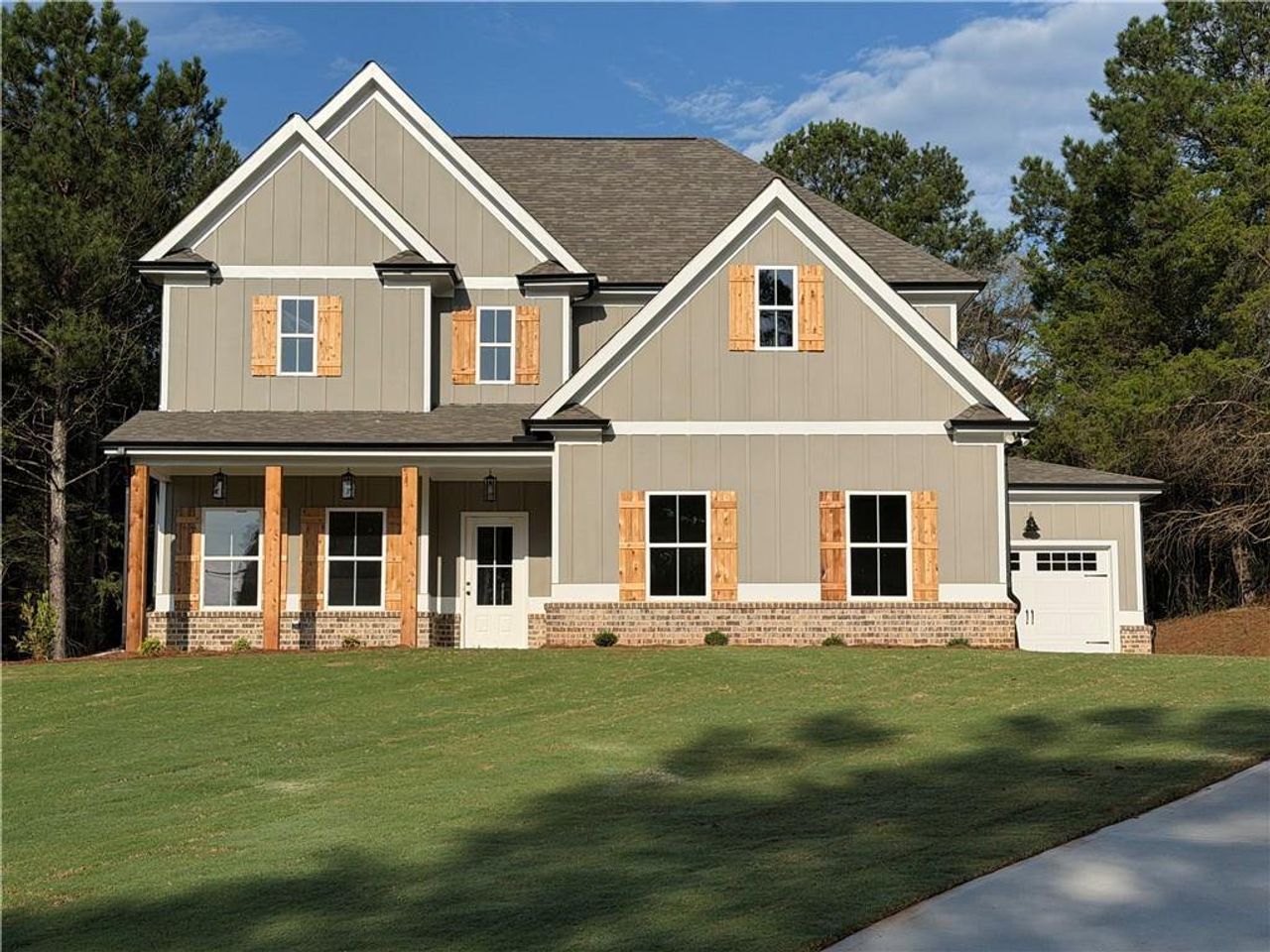 Front exterior of a new home in , Covington, GA, highlighting curb appeal (Image 2).
