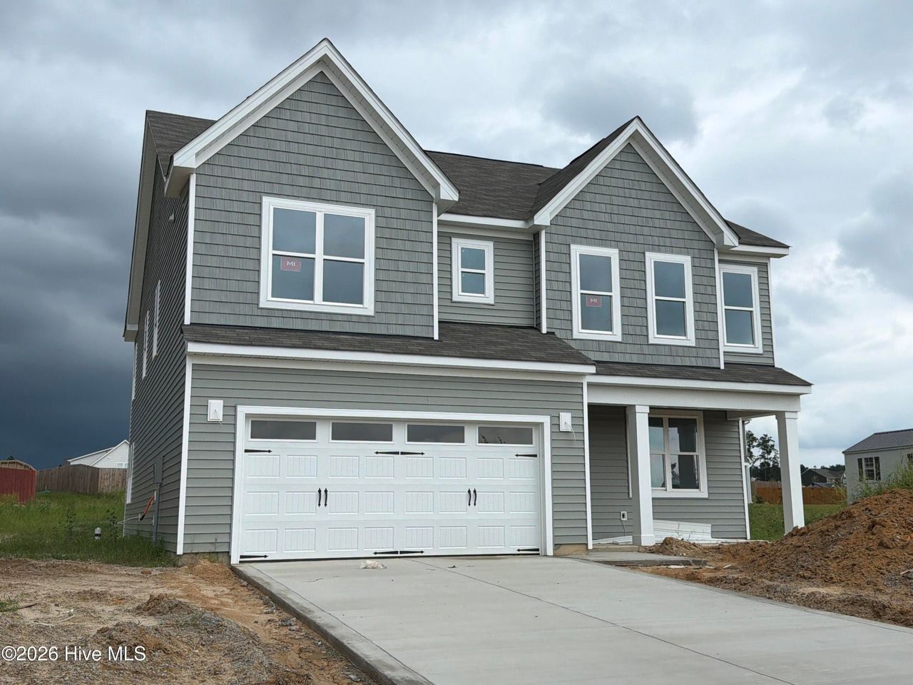 Front exterior of a new home in Sandy Springs, Aberdeen, NC, highlighting curb appeal (Image 2).