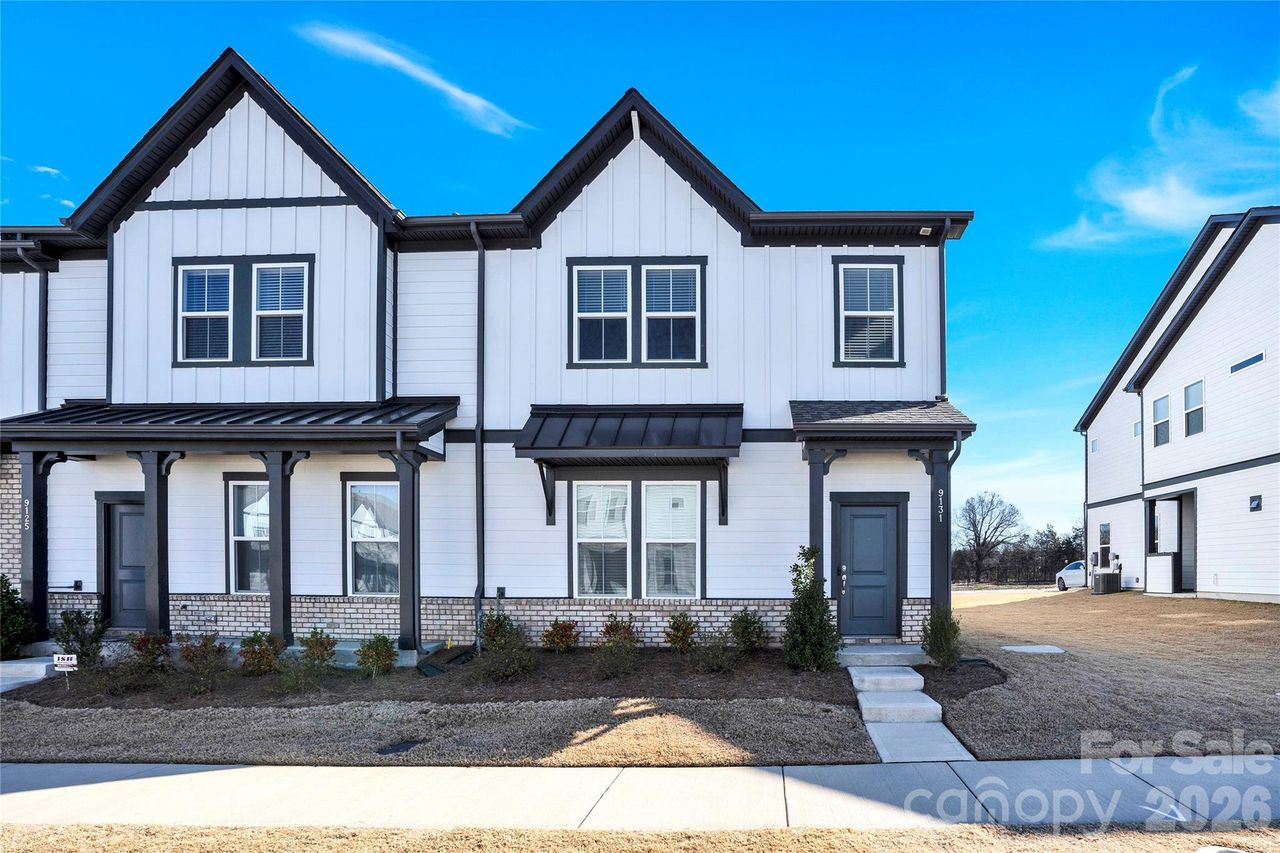 Front exterior of a new home in Terraces at Farmington, Harrisburg, NC, highlighting curb appeal (Image 2).