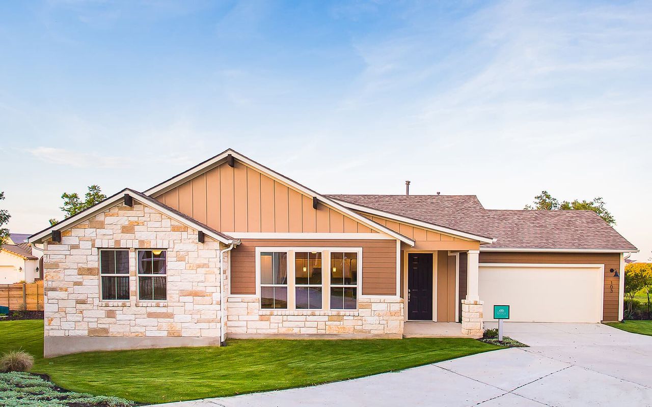 Front exterior of a new home in Cottage at Kissing Tree, San Marcos, TX, highlighting curb appeal (Image 2). Front exterior of a new home in Cottage at Kissing Tree, San Marcos, TX, highlighting curb appeal (Image 2).