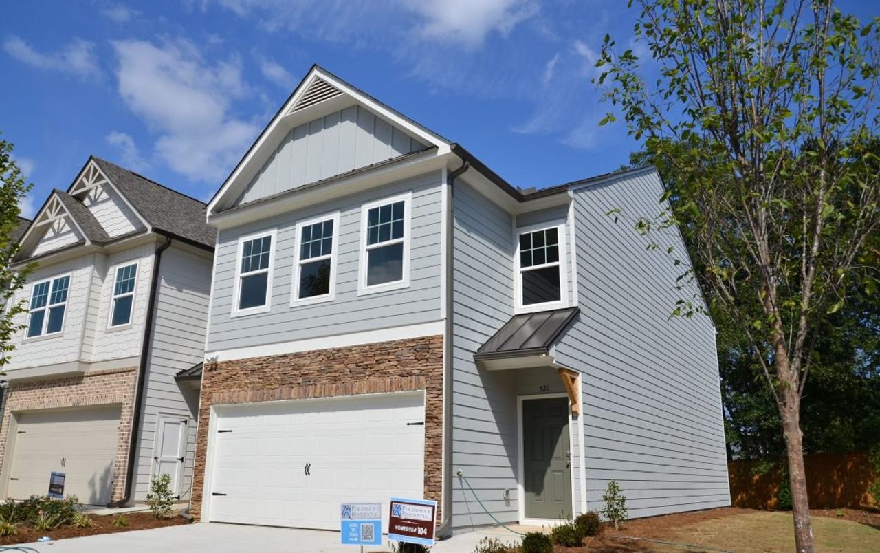 Front exterior of a new home in Owen Preserve, Canton, GA, highlighting curb appeal (Image 2).