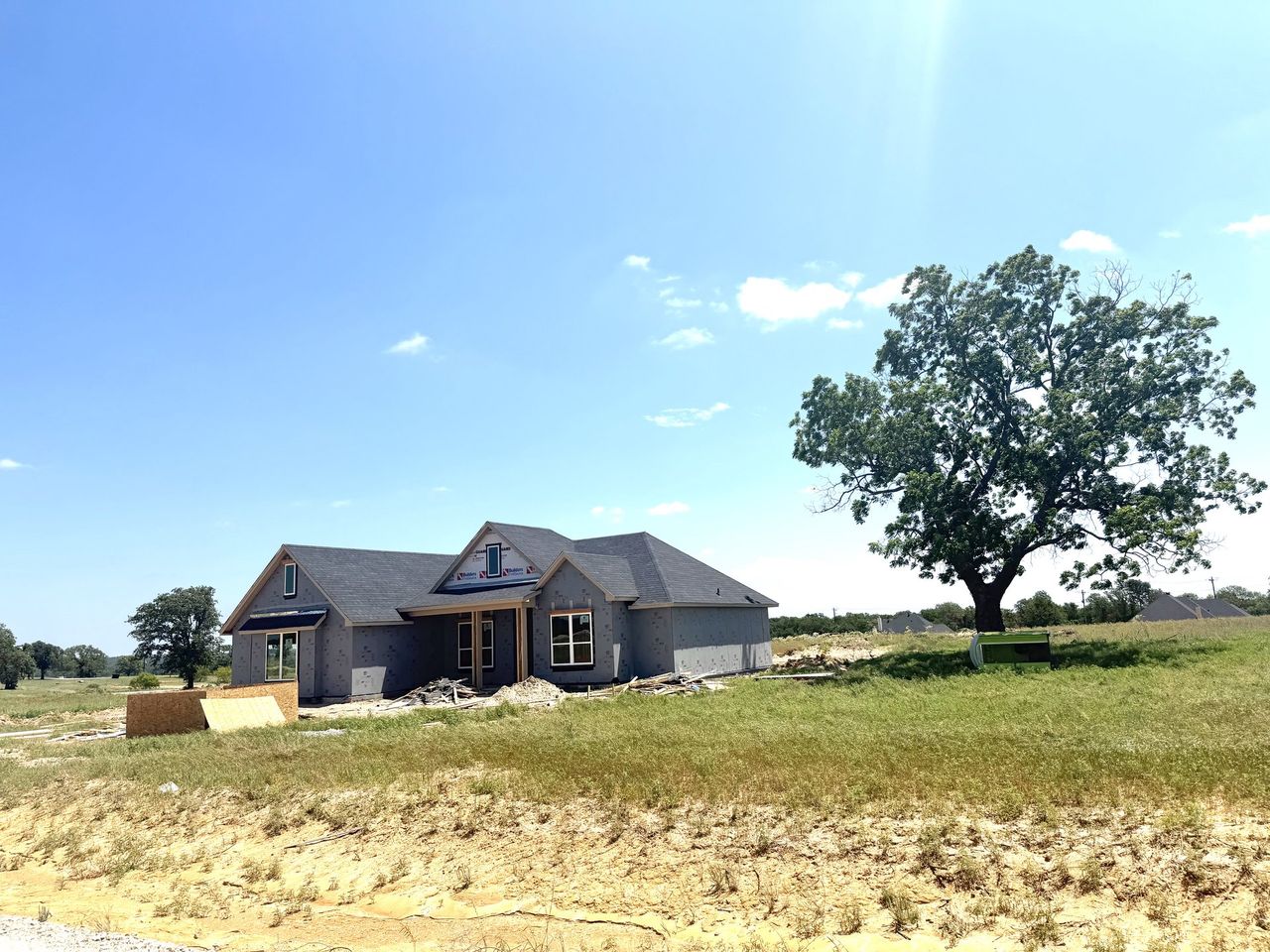 Front exterior of a new home in Zion Valley, Poolville, TX, highlighting curb appeal (Image 2).