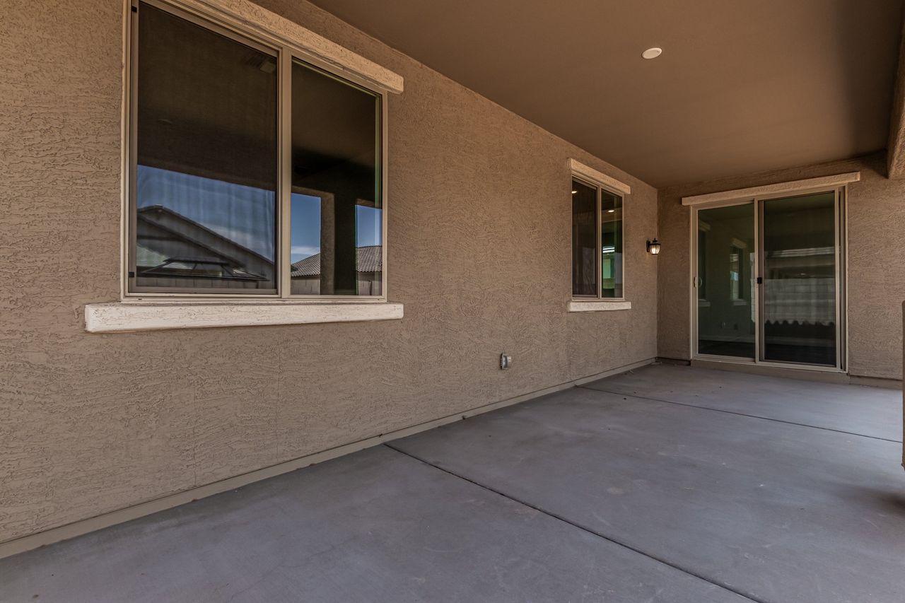 Exterior details and patio area of a home in The Villages at North Copper Canyon, Surprise (Image 2).