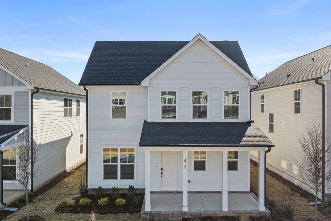 Exterior details and patio area of a home in Saunders Farm, Willow Spring (Image 2).